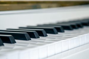 closeup-white-piano-keys-musical-background